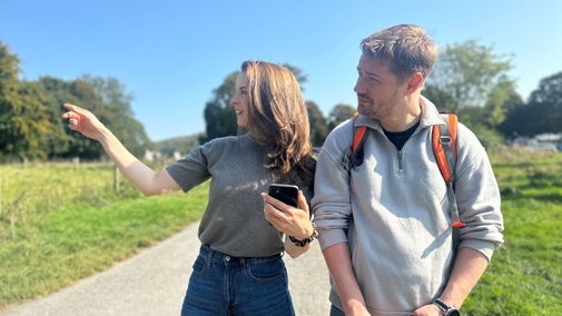 A couple using the HistoryScapes app are pictured enjoying a walk around the Saltram estate in the sunshine